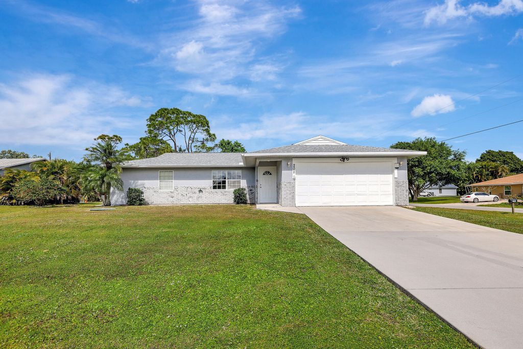 Photo of 201 SW Crescent Avenue, Port Saint Lucie, FL 34984 (MLS # R10960486)