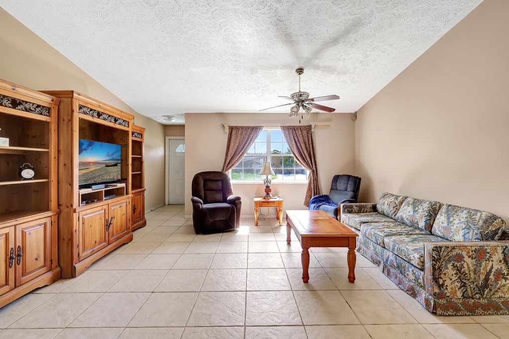 Photo of 201 SW Crescent Avenue, Port Saint Lucie, FL 34984 (MLS # R10960486)