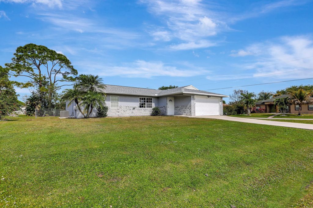 Photo of 201 SW Crescent Avenue, Port Saint Lucie, FL 34984 (MLS # R10960486)