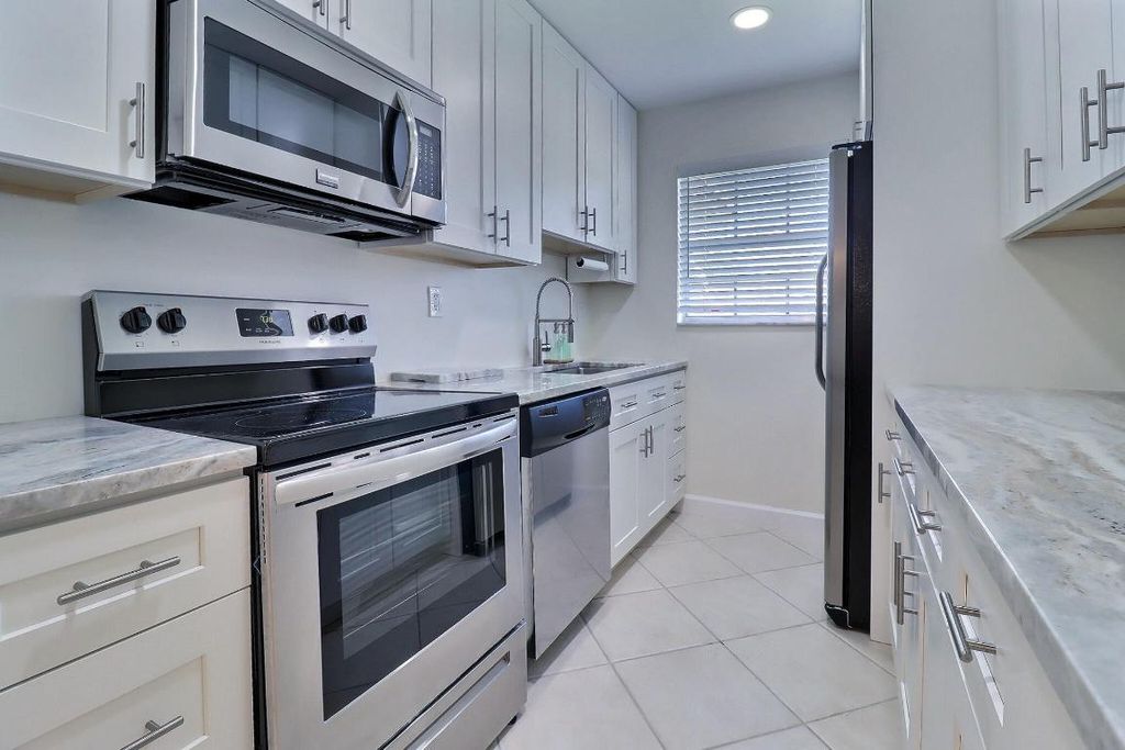 Photo of 1330 High Point Place N #C, Delray Beach, FL 33445 (MLS # R11136428)
