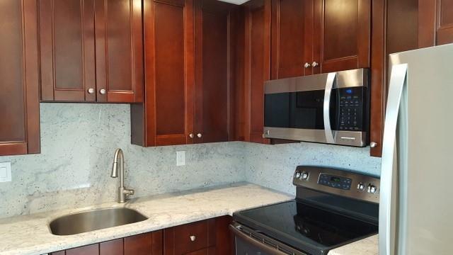55+ community. Welcome to this appealing second-floor residence in the desirable gated community of Kings Point. This spacious condo features a large primary suite with walk-in closet, fully renovated interiors, and abundant storage throughout. Impact windows and doors, plantation shutters, tiled floors provide both style and peace of mind. Washer and dryer in unit. Kings Point offers a vibrant lifestyle with three clubhouses, heated pools, golf, tennis, pickleball, fitness center, on-site cafes, and a variety of social activities. Ideally located just minutes from shops, restaurants, major highways, and only 15 minutes to Downtown Delray Beach and the ocean. Enjoy the perfect blend of comfort, security, and active living in one of South Florida's most sought-after 55+ communities.