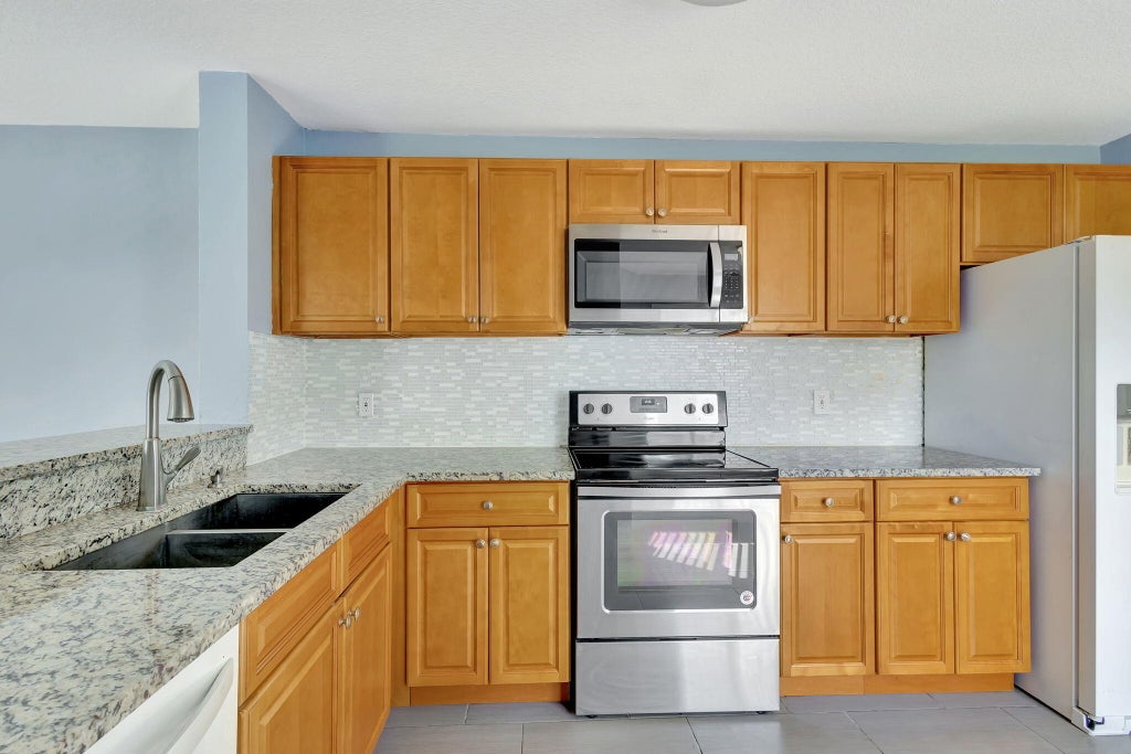 Photo of 1571 Woodbridge Lakes Circle, West Palm Beach, FL 33406 (MLS # R11032951)