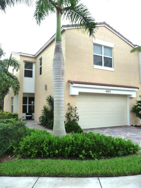 SPACIOUS End Unit Towne-3 Bedroom 2.5 Bath, Custom Painted, IN MINT CONDITION IN GATED COMMUNITY Just 3 Mins West of I-95. 7 Mins TO BOCA TOWN CTR MALL, 3 Miles TO BEACH! GREAT SCHOOLS! WALK TO SHOPS, RESTAURANTS, LIBRARY & LYNN UNIV, FAU! 2161 sq ft Guava Model - GREAT OPEN FLR PLAN - Entertain in your 891sf 1st floor Family Room & Kitchen + Backyard Patio! Hi IMPACT WINDOWS (no shutters needed!),2 CAR GAR.SS APPL's,SxS FRIDGE,GRANITE COUNTERS, HUGE ISLAND SEATS 4, M/bath w/GRANITE COUNTERS,UPGR'd CERAMIC TILE 1ST FLR. LARGE 2ND FLR LAUNDRY RM, UPGR'd W/D, M/BR Custom WALK-IN CLOSET,RECESS LIGHTs THRU-OUT.9'CLG's, Fitness ctr, Pool & walk to 41 acre Blue Lake with 2+ miles of Trails & 78 acre Nature Preserve with Trails. Come see your new home!
