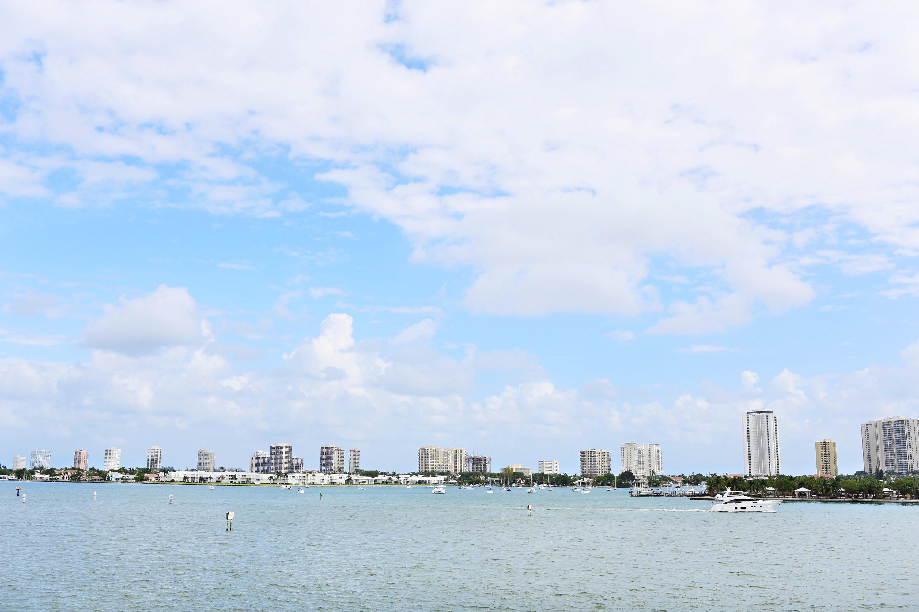 BEST DEAL!! Stunning views from this direct lower floor intracoastal 3 bedroom 3 bath condo in the most preferred Ocean Tower SE corner. 9ft ceiling unit completely updated. Upgrades include: polished French pattern travertine marble floors throughout white marble kitchen counters with porcelain subway tile backsplash, SS deep sink w polished chrome faucet, new $5,000 air conditioner, crown moulding in every room, new trim throughout, all new Toto commodes and new hardware throughout. Amenities include 24 hour security guard, rooftop heated pool, 2 tennis courts, exercise room, social room, sauna/steam room, billiard room, card room, valet, and Marina located adjacent to the property. Short walk to the beach. Publix across the street. Must see to appreciate ALL the features!!