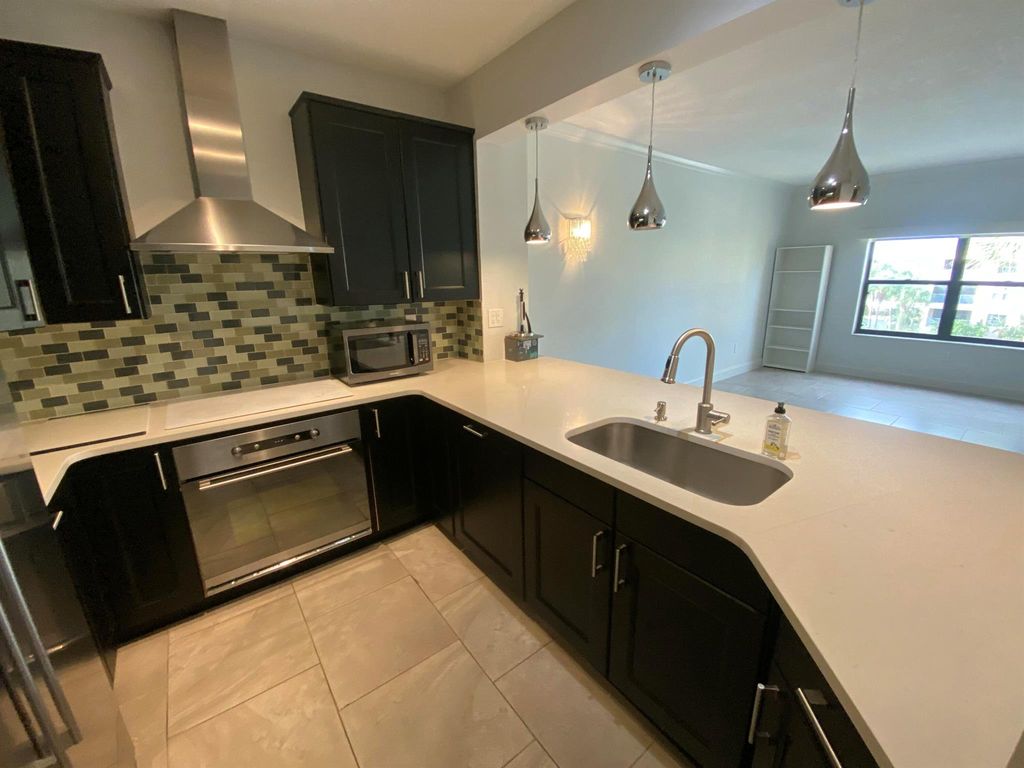 Photo of 400 Uno Lago Drive #403, Juno Beach, FL 33408 (MLS # R11131240)