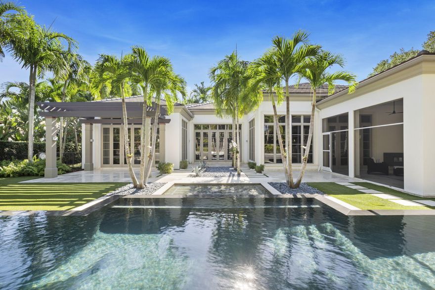 This lovely California style home is situated on a half acre lot in the sought after Grand Estate section of Old Palm Golf Club. A custom luxury home designed by award winning Randall Stofft Architects. Stunning architecture and thoughtful design allows for open, expansive and light-filled spaces. As you enter, you'll find beautiful wide plank walnut wood flooring with marble inlays and 14-15 foot coffered ceilings with cove lighting. The split floor plan conveniently has the primary suite located on the east side where there's dual closets along with a 3rd very spacious closet that could be used as additional closet space, nursery, or her office. The primary bathroom is inviting with Cesar stone counters, 18x20 Porcelana tiles, & Waterworks large stand alone tub. Leaving the primary you'll pass the limestone fireplace in the living room and make way to the gorgeous kitchen with wolf induction and thermador oven. The kitchen also features two sub zero refrigerators with wine cooler, viking dishwasher, and ample cabinets. This home is light and bright with 10ft French doors and floor to ceiling windows throughout. 
Step outside onto the Syrian limestone outdoor flooring into an all screened-in outdoor lanai with fireplace. Outside, the home showcases diverse outdoor living spaces, which a 60 ft lap swimming pool, cedar pergola and astroturf throughout. The whole house water filtration is also used for the pool. 
Let's visit the guest suites where immediately you'll see how spacious the rooms are. Bedroom #2 features cove lighting, valances, en-suite bathroom with tile to ceiling, Cesar stone counters, plantation shutters, and 10 ft door with transom windows.
Bedroom #3 is currently used as her office. The large room has stunning natural light, ample cabinets for storage, and shares a jack and Jill bathroom with Bedroom #4. 
The office displays beautiful wood built-ins and wood beam ceiling and half bathroom. An art gallery hallway with attention to ceiling detail and cove lighting. 
Custom features include plantation shutters, 10 ft solid core doors, whole house generator, whole house water filtration, impeccable millwork, outdoor cypress pergola with reinforced metal and more.
The 3 garage has epoxy flooring, storage cabinets and 2 tankless water heaters. This home is not one to miss!
Old Palm has an 18-hole championship golf course completely re-designed by Raymond Floyd, a new completely renovated clubhouse (Jan 2024) with casita's, restaurant, cafe, fitness center, lap pool, mens and women's spa and pickle ball courts. 
If you are looking for an exclusive golf course and luxurious home in Palm Beach Gardens, Old Palm Golf Club is one of the most desired choices.