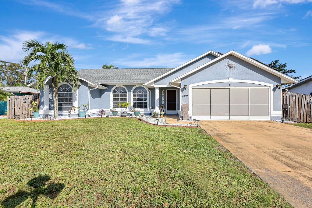 Photo of 209 Ramie Lane, Port Saint Lucie, FL 34952 (MLS # R11031210)