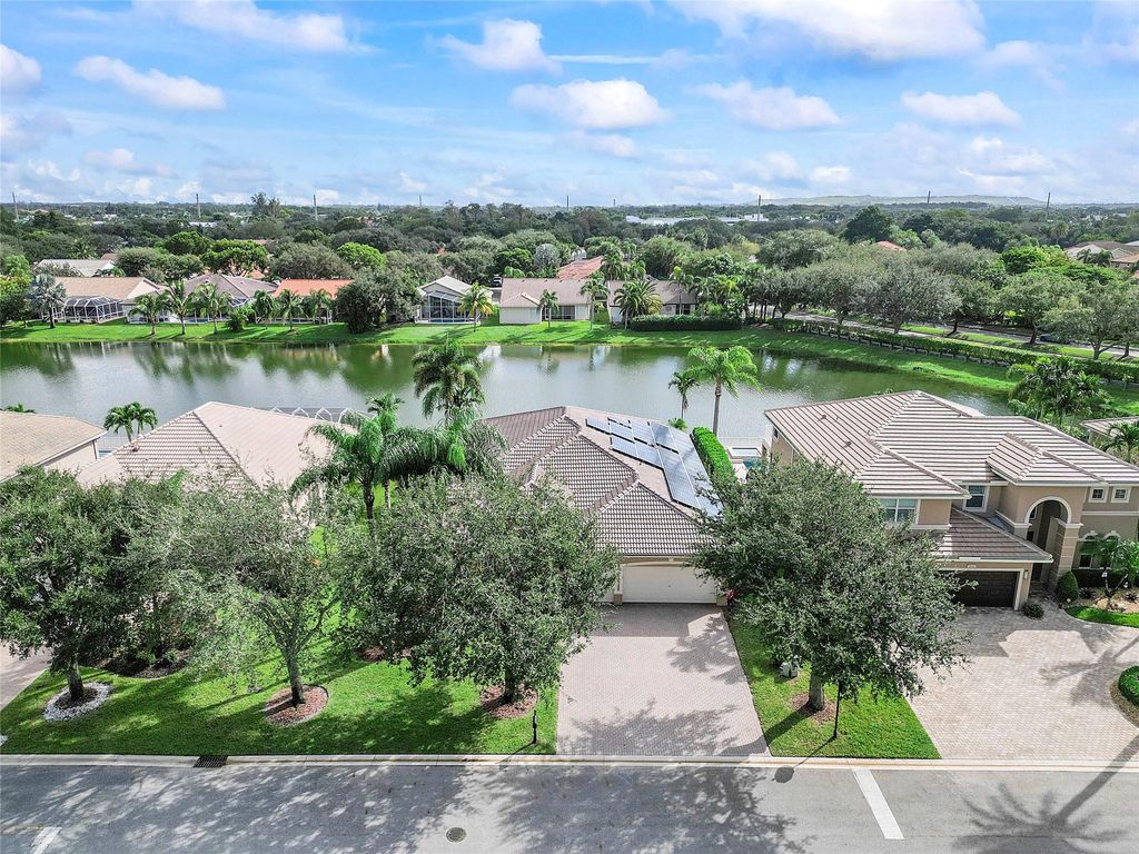 Photo of 5840 NW 54th Circle, Coral Springs, FL 33067 (MLS # F10512664)