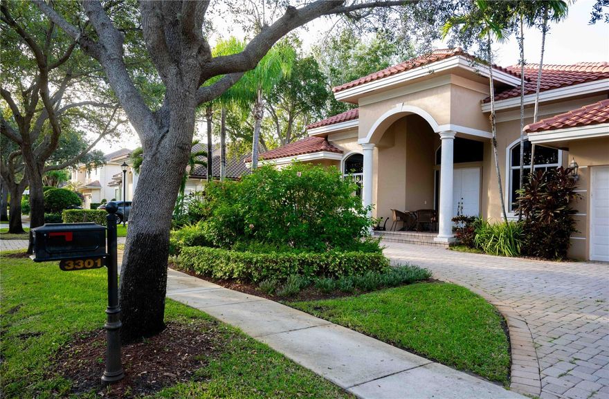 This Elegant Home Features Five Bedrooms Plus Office Which Could be a Sixth Bedroom, Four and a Half Bathrooms, Gourmet Kitchen With a Gas Stove, Large Formal Dining Room and Wet Bar, Oversized Master Suite, Triple Split Bedroom Plan Provides Privacy, Tropical Pool, Large Corner Lot Three Car Garage and Three Zone A/C.. Located on the East Side of Hollywood Oaks and is located near House of Worship, Schools and Shopping. The Community Features 24 Hour Guard Gate, Community Pool, Gym, Clay Tennis Courts, Basketball Court, Playground and Wonderful Biking and Walking Paths Around Beautiful Lakes. The Community is Located Near I95, Fll Airport.