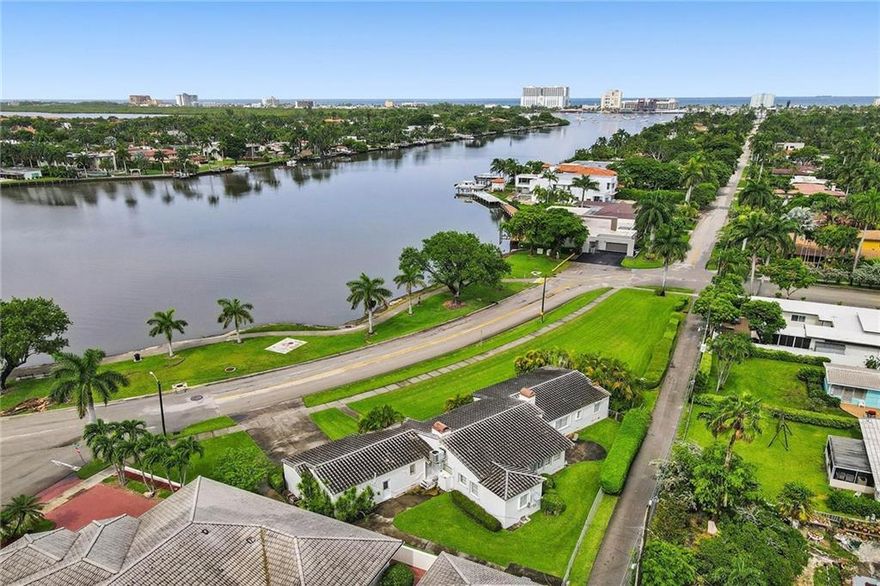 This vintage 6 bedroom 4 bath waterfront corner lot home, with beautiful natural light throughout, features wide-angle water views from the living room, dining room, and three of the six bedrooms.Walk-in closets, Large Italian tiles, colorful eclectic tiled bathrooms, and hardwood floors, even under the new carpet. The historic fireplace has a unique plaster/concrete swordfish design. Interior designer's dream on this just under 1/2 acre double lot. No fixed bridges, bring your sailboat or large yacht to the marina down the street. Hollywood Lakes is a highly sought after area 1.5 miles to Hollywood Beach and downtown Hollywood. Close to Hollywood Marina, Margaritaville, casual & upscale dining, all major airports, casinos & shopping.