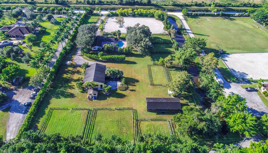 Very private 5 acre property 1 1/2 miles south of main equestrian venues. Turnkey 6 bedroom, 3 bath furnished house with private pool. Equestrian amenities include  220' x 180'  ring. Two barns 8 stalls each, and ample room for temporary stalls.  4 wash stalls attached to first barn, tack room, feed shed,  10 large paddocks.  Maintenance machinery on site.