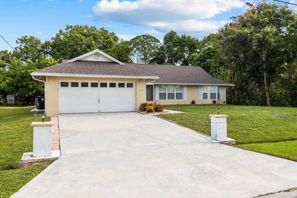 Photo of 1799 SW Taurus Lane, Port Saint Lucie, FL 34984 (MLS # R11136585)