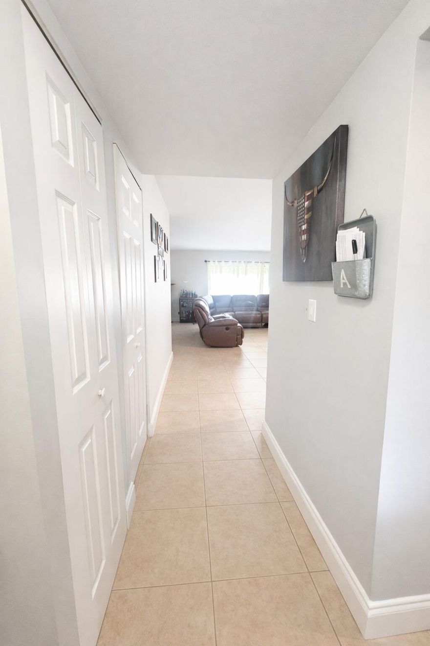 Beautifully maintained 2-bedroom, 2-bathroom condo perfectly situated on the golf course, offering serene views and a relaxing lifestyle. This inviting home features two private patios, one screened-in for year-round enjoyment—ideal for morning coffee or evening unwinding. The interior boasts tile flooring in the main living areas, with warm wood floors in both bedrooms. The well-appointed kitchen includes granite countertops and a brand-new stove and tons of cabinets.  The unit has a newer air conditioning system for added comfort. A full-size washer and dryer are conveniently located in the unit. The spacious second bedroom is enhanced with elegant French doors, making it perfect as a guest room, office, or den. One bathroom has been tastefully remodeled, adding a modern touch.