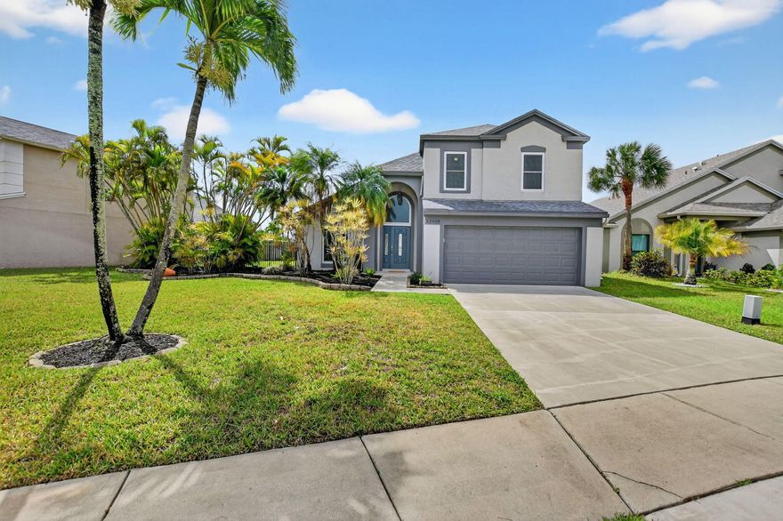 Welcome to this beautifully updated home located in the highly desirable Boca Winds - Regency Place community in West Boca Raton. Zoned for A+ rated schools and just minutes from excellent shopping, dining, and everything Boca has to offer.  This home has been thoughtfully upgraded throughout, featuring a fully renovated kitchen (2017) with top-of-the-line KitchenAid appliances, including a trash compactor, microwave drawer, and rare 2-drawer dishwasher—perfect for everyday living and entertaining.  Additional major upgrades include a new roof (2022), impact windows and doors (2012), metal fencing (2017), exterior paint (2023), and fresh interior paint (2026)—making this home truly move-in ready.