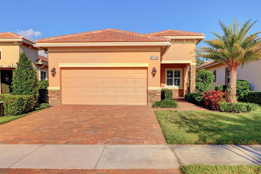 Straight out of a magazine! Immaculate, energy-efficient home nestled in the highly desirable community of PGA Verano. Pickle ball players, golfers and poolside loungers will love these amenities. This home boasts absolute luxury, plantation shutters, quartzite countertops, level-4 white cabinetry, 24â� level-5 white tile floors and a custom garage loft storage with epoxy flooring. Enjoy a morning coffee on the screened lanai whilst listening to the birds, or wine on the porch while taking in sunsets above the lake. Affordable, resort-style living in a gated, secure community; adjacent to the 54-hole PGA Golf Club, 40,000 sq ft clubhouse/fitness center, 27 pickle ball courts, an indoor lap pool, 5 Har-Tru Hydro tennis courts, resistance pool, 7,000 sq ft E-Gym, ballroom, and more!