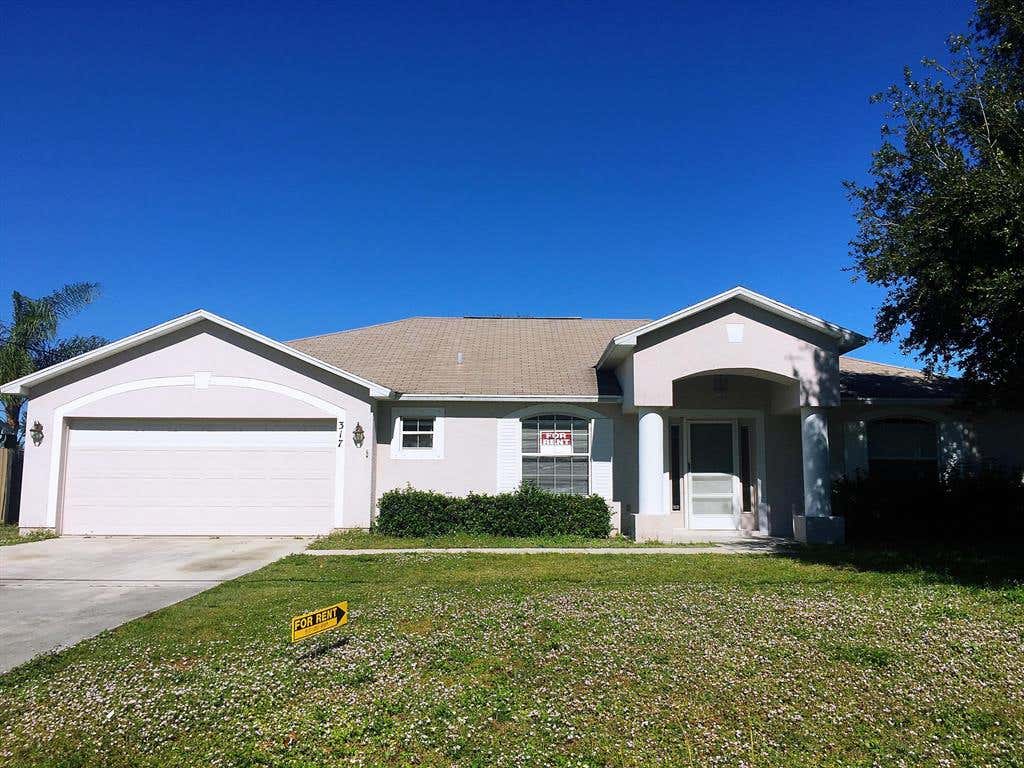 Photo of 317 SW Whitmore Drive, Port Saint Lucie, FL 34984 (MLS # R10761400)