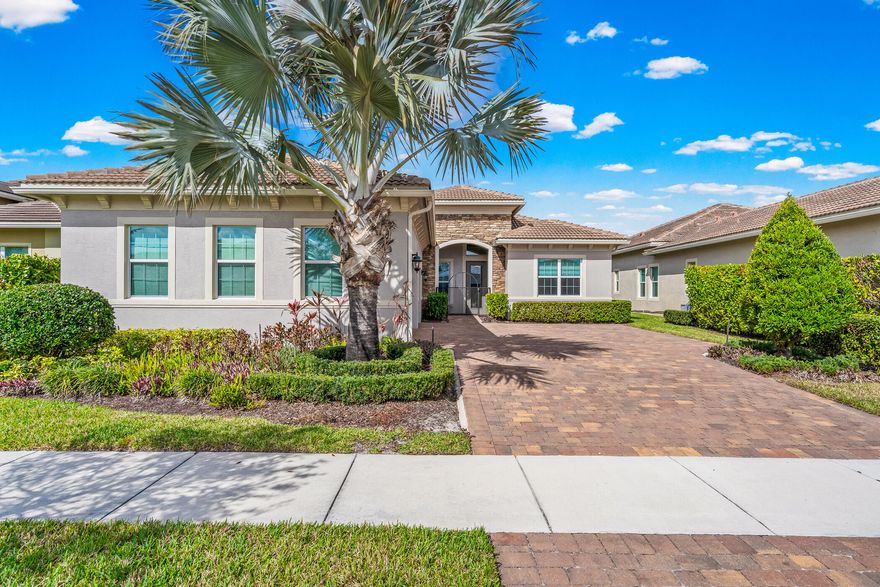 write a property description no more than 800 characthers for 9122 SW Pepoli Way Port St Lucie, Fl

Discover this stunning Dulce floor plan home in the desirable PGA Verano community of Port St. Lucie, offering serene lake views! Built in 2021, this 3-bedroom + den, 3.5-bath residence spans 2,563 sq ft with en-suite bedrooms and over $160K in premium upgrades: impact windows/doors, quartz countertops, porcelain wood-look tile throughout, custom lighting, recessed lights, motorized shades, and 8 ceiling fans.The chef's kitchen features upgraded appliances, custom backsplash, and island tile. Enjoy a custom office with 12-ft quartz desk and shelving, plus a stylish entertainment cabinet. Step outside to an expanded screened patio with sunscreens, new fencing, and peaceful water views.