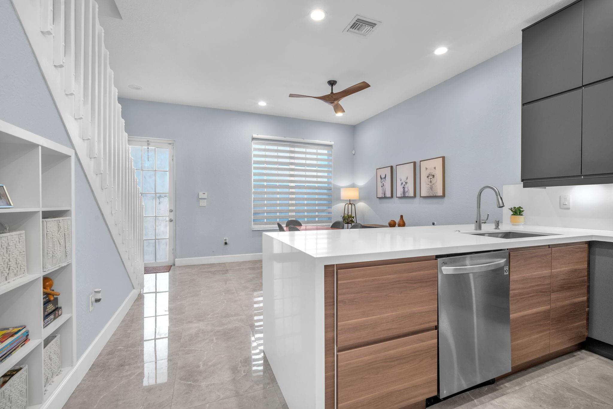 Completely Renovated top to bottom! New porcelain tile & wood flooring, modern clean bathrooms and new kitchen! AC 2022, Tankless Water Heater 2020. Thoughtful details like hidden under-stair storage with a bookshelf and recessed lighting add functionality and charm. *Single Family, Not a Condo!* Enjoy the convenience of an HOA that includes Xfinity TV, internet, alarm, security, a resort-style pool, and a gym. Prime location close to the highway and minutes from everything in Pembroke Pines.