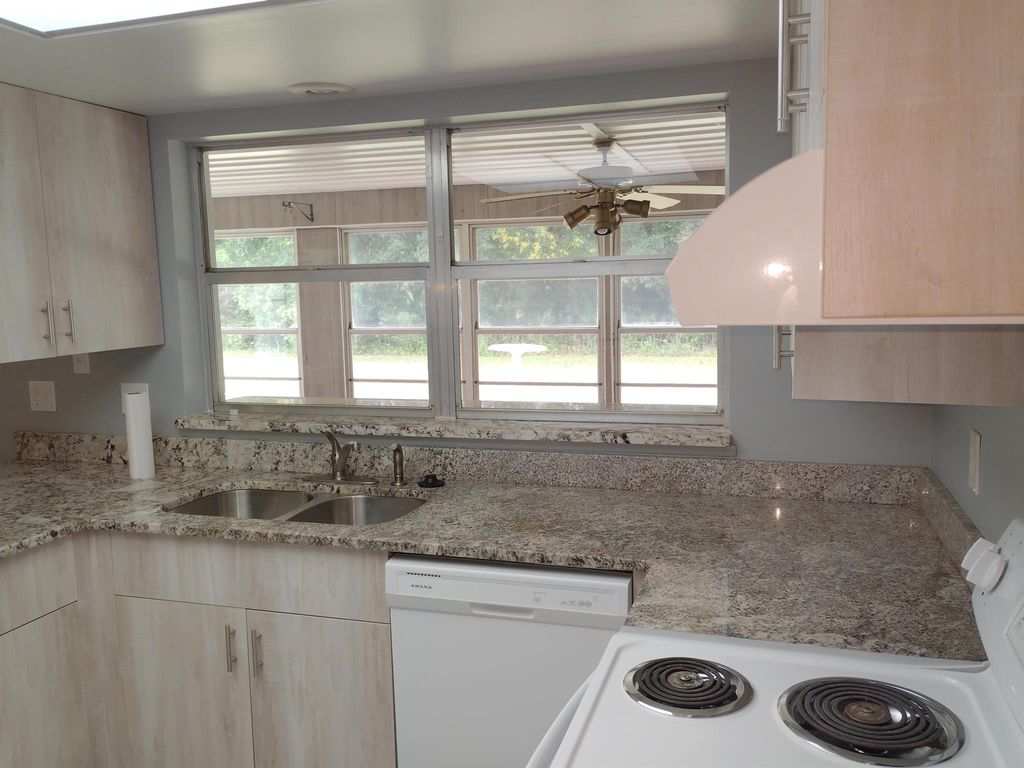 Photo of 300 NE Solida Drive, Port St Lucie, FL 34983 (MLS # R11020464)