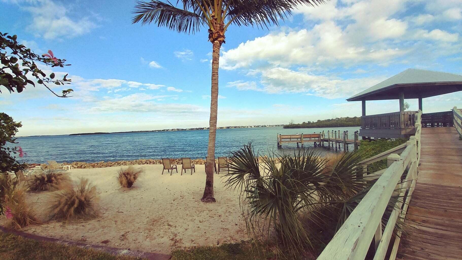 AVAIL for next seasson starting Oct 2025 to May 2026 This pristine 3/2/1 unit is located in the hidden paradise of Schooner Oaks, in Rocky Point. Lush natural landscape surrounds this private, cozy, & friendly community, located directly on the intracoastal waterway. Front door is just steps away to private boardwalk, gazebo, and beach area, where you can launch kayaks, paddleboards, fish...or just relax in the sun at the water's edge! Spacious floorplan, updated throughout, 3 bdrm all with king size beds, plenty of room for everyone, as well as a large screened in porch! Minutes to waterfront restuarants, shopping, and downtown Stuart.