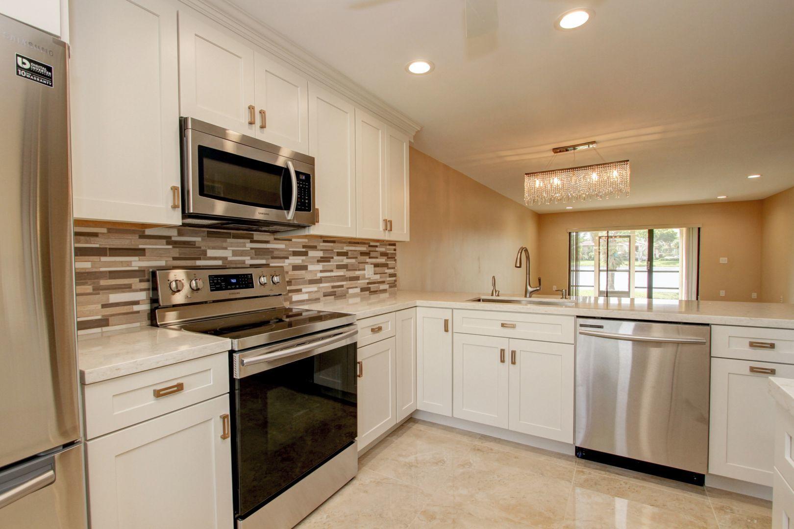 Be the first to rent this magnificently upgraded first floor, 2 bedroom, 2 Bath condo in the Pines of Boca Lago with spectacular lake and sunset views. Featured are an open custom kitchen with wood cabinets, quartz counter tops and high-end stainless steel appliances, a large master bedroom suite with 3 closets, dual sinks, designer finishes and a large second BR and bath. Included also are upscale light fixtures & recessed LED lights, refinished smooth ceilings, 24'' porcelain tiles throughout, and a covered rear patio. The community pool and clubhouse are very close by. See 360 deg. virtual tour photos in listing. Optional Social, Tennis or Golf memberships are available but are not mandatory: Boca Lago Country Club: www.BocaLago.com