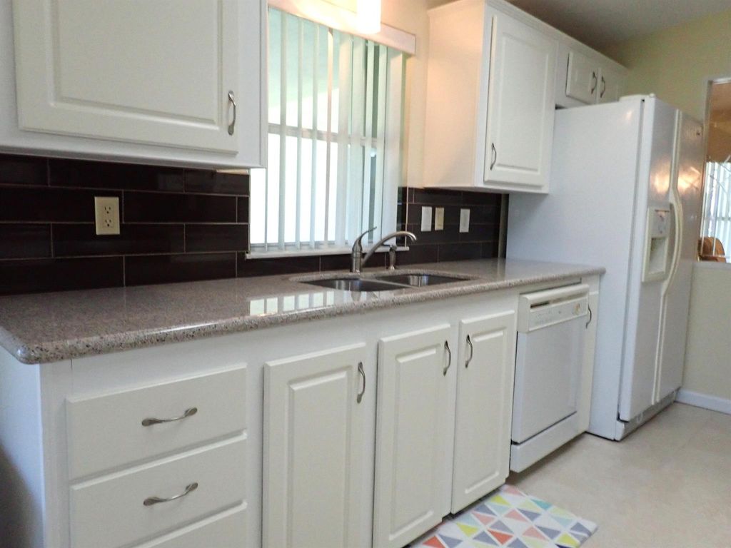 Photo of 8036 9th Hole Drive, Port Saint Lucie, FL 34952 (MLS # R10933946)