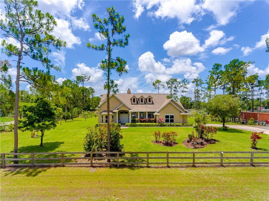 SPECTACULAR AND SPACIOUS 5 BEDROOM 3 1/2 BATHROOM POOL HOME WITH A BONUS ROOM/OFFICE/DEN WITH A 2 CAR GARAGE*EXTRA LARGE CARPORT 30X40*THIS HOME SITS ON 2.28 ACRES COMPLETELY FENCED AND CROSS FENCED*POOL IS HEATED AND SCREEND IN WITH A RAISED SPA*BEAUTIFUL BBQ AREA WITH REFRIGERATOR THIS HOME HAS BEEN COMPLETELY REMODELED*STATE OF THE ART KITCHEN WITH QUARTZ COUNTER TOPS,SHAKER WOOD CABINETRY WITH UNDER THE COUNTER LIGHTING,KITCHEN AID APPLIANCES, STAND ALONE ISLAND AND LARGE PANTRY*ALL BATHROOMS HAVE BEEN COMPLETELY REMODELED*BARN 30X50 WITH ELECTRIC AND WATER(2020)*ROOF 2019*IMPACT WINDOWS*500 GALLON PROPANE TANK* TOP OF THE LINE RINNAI TANKLESS WATER HEATER(2021)* OSMOSIS WATER FILTRATION SYSTEM FOR THE ENTIRE HOME.