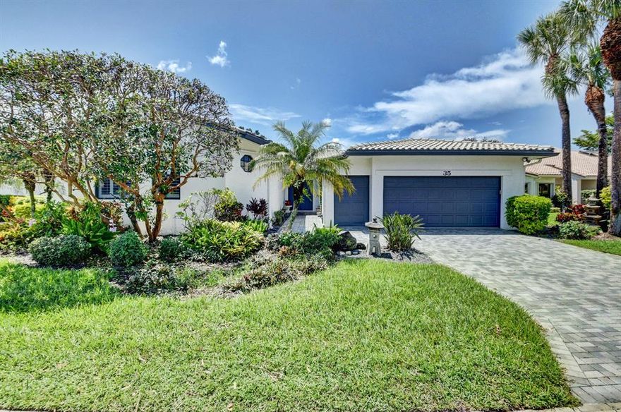 Luxurious custom decorated home with panoramic golf and water view! This home has been expanded to include a large, bright and gorgeous Florida/Family room, a guest bedroom with a vaulted ceiling and a extra 1/2 bath There are many beautiful  built ins throughout. The volume ceiling and skylights provide for a open floor plan which provides great flow for entertaing. The kitchen features granite counters, undermount sink, skylight, pantry and so much more. The master suite has a large entry, 2 large outfitted closets, volumre ceiling  and stuuning bath. There are a total of 3bedrooms + den for sleeping. Hurricane shutters, 2.5 car garage, extended patio with awning, gorgeous landscaping all add to a fantastic ambience for country club living!!!