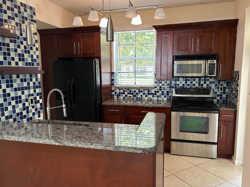 Photo of 4822 Chancellor Drive #10, Jupiter, FL 33458 (MLS # R10975363)