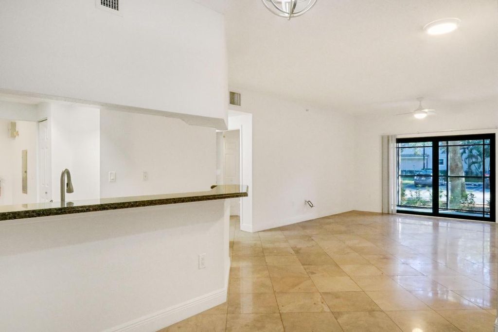 Photo of 3023 Alcazar Place #102, Palm Beach Gardens, FL 33410 (MLS # R10982603)