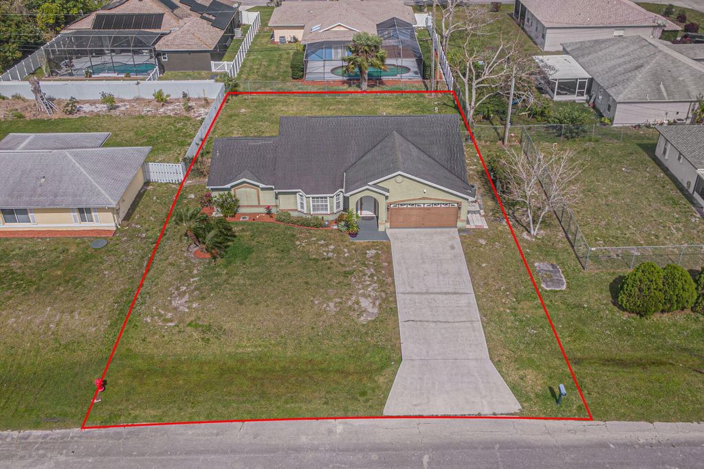 Photo of 407 SW Laconic Avenue, Port Saint Lucie, FL 34953 (MLS # R10959012)