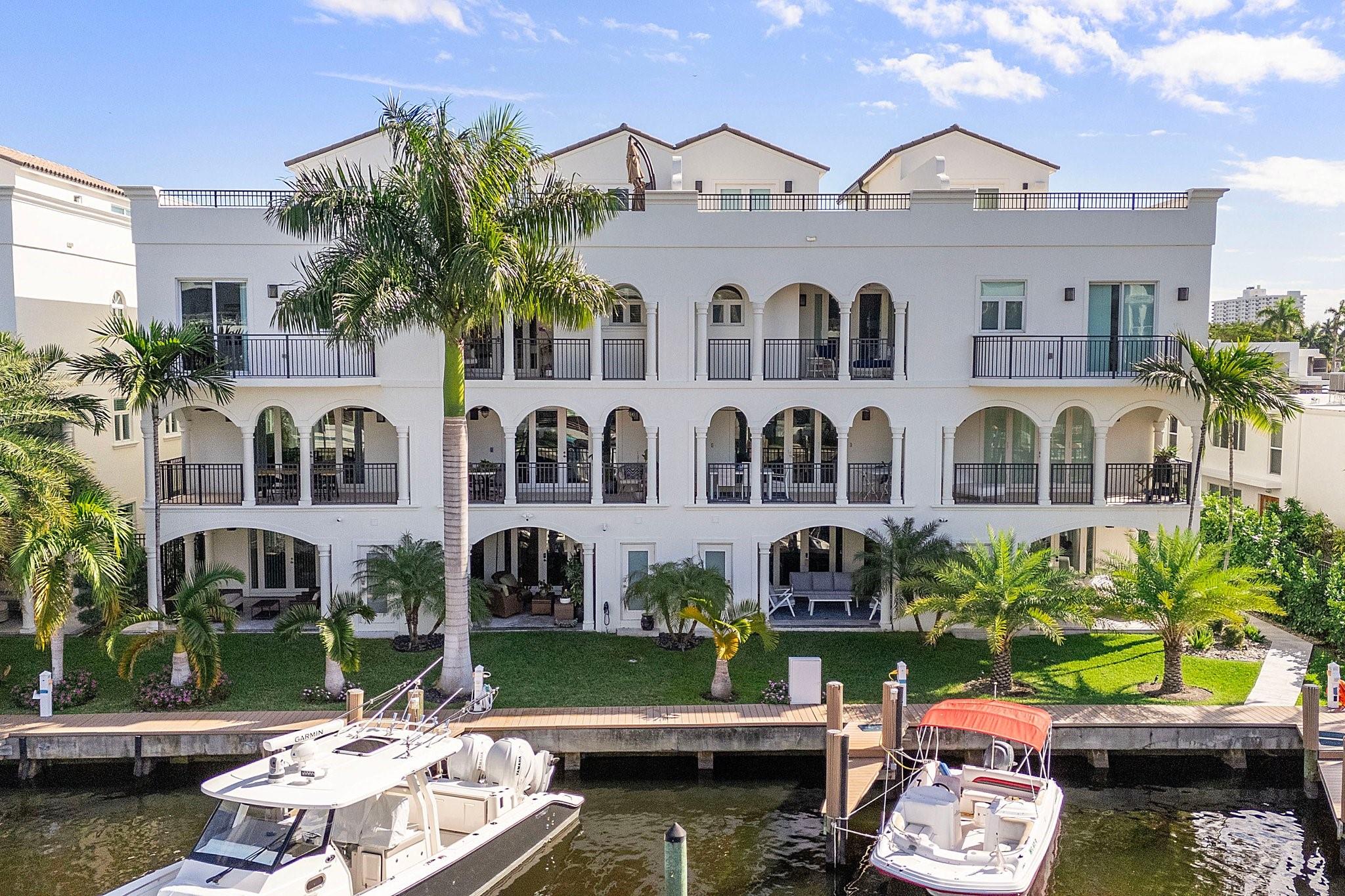 Experience the Ultimate Waterfront Lifestyle in this updated townhome, complete with a private dock accommodating vessels up to 55 feet. This residence offers a spacious, thoughtfully designed layout with four bedrooms plus a loft, and 4.5 baths. Available partially furnished, the home showcases covered terraces, a private elevator, impact windows, and a rooftop deck with panoramic skyline views. A gated driveway and two-car garage provide secure parking for up to four vehicles. Located in the coveted Las Olas area, you’ll enjoy proximity to fine dining, boutique shopping, and Fort Lauderdale’s pristine beaches. Pets considered. See broker remarks,