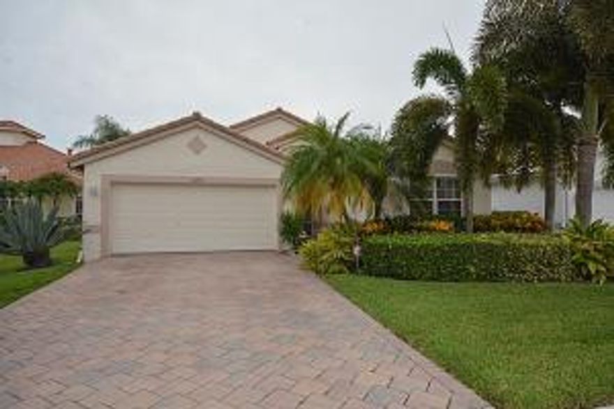 A gem of a house in maintained gated community of Crescent Lakes! Comes with a 2 car attached garage, paver driveway, beautiful landscaping, screen porch, and interior having open floor plan, vaulted ceilings, sparking tile throughout, remodeled kitchen w/ granite counter tops, modern appliances & custom cabinets as well as new AC. Make this your home now.  Easy showing.