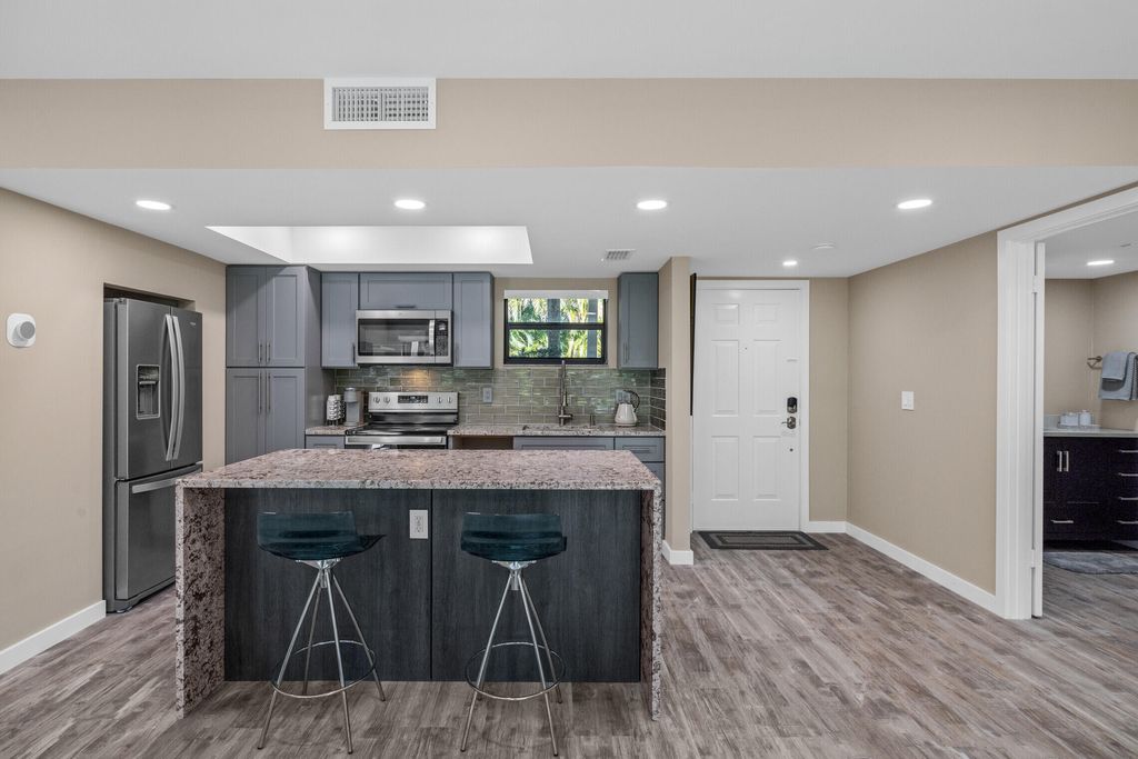 Photo of 11863 Wimbledon Circle #438, Wellington, FL 33414 (MLS # B26020075)