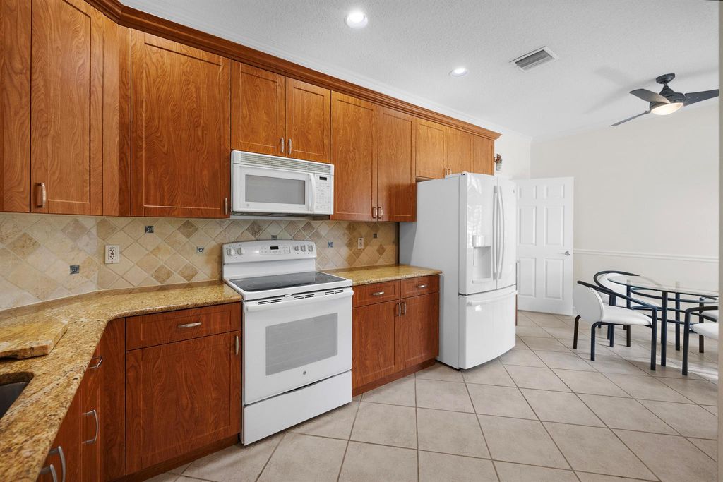 Photo of 9615 Crescent View Drive N, Boynton Beach, FL 33437 (MLS # R11129778)