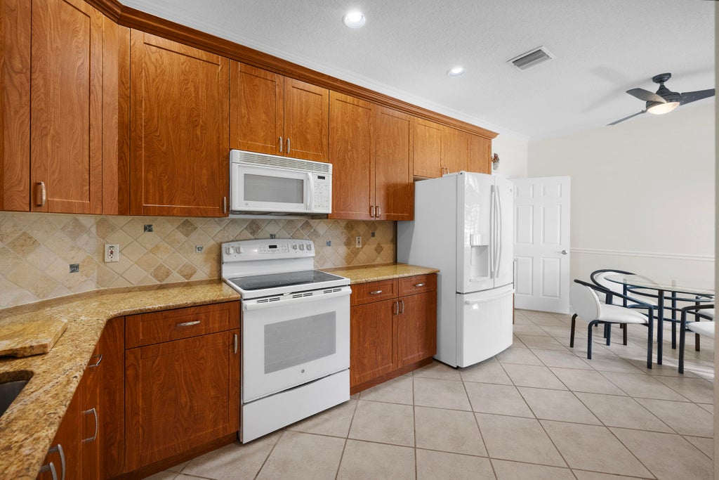Photo of 9615 Crescent View Drive N, Boynton Beach, FL 33437 (MLS # R11129778)