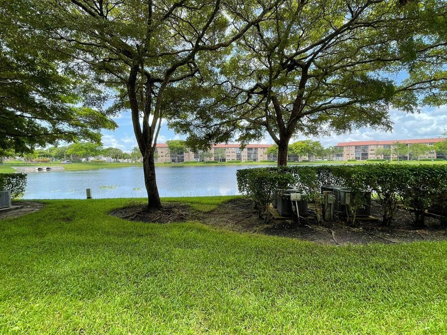 Beautiful lakefront apartment featuring the largest 1-bedroom, 1.5-bath model in Century Village Pembroke Pines. Located in the newest building on the first floor, with parking directly in front and the pool just steps away. This bright and spacious unit offers an eat-in kitchen, walk-in closet, and walk-in shower, and is conveniently close to the main entrance. Enjoy resort-style living with exceptional amenities including pools, golf, tennis, clubhouse, theater, billiards, fitness centers, sauna, and a wide variety of shows, classes, and activities. At least one occupant must be 55 years of age or older. Minimum 650 credit score required.