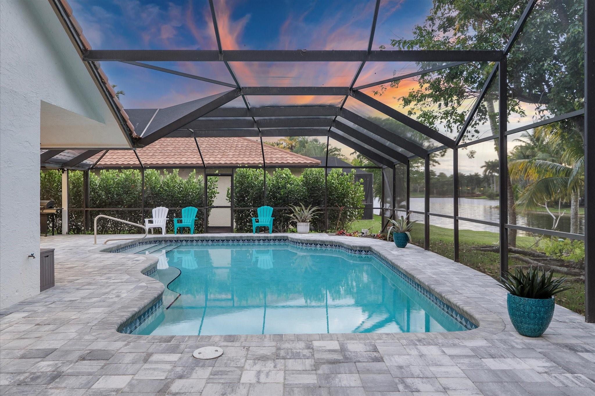 ***Seller to pay $5k toward buyers interest rate buydown, paid at closing****Exquisite Waterfront Home in Exclusive Tequesta Community. Nestled among gorgeous tree-lined streets and picturesque lakes, this beautifully renovated home offers upscale living with breathtaking water views. The thoughtfully designed split floor plan creates a spacious and inviting atmosphere. Recent upgrades include high-quality flooring throughout and stylish light fixtures. A fully remodeled kitchen boasts ample workspace, sleek finishes, and brand-new appliances (2023). The primary bathroom has been elegantly updated. Outside you'll find an enclosed private heated pool oasis, perfect for relaxation. A paver circular driveway enhances curb appeal, while the 2009 roof ensures lasting durability.