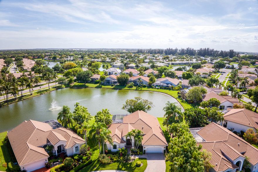 Serene lakefront pool home in gated Aberdeen CC w/ fountain views from every main living area. NEW impact windows & doors (2025), NEW roof (2021), NEW dual A/C (2022) — the big tickets are done. Open floor plan w/ polished tile, vaulted ceilings & walls of impact glass. Triple split 3BR/3BA. Primary suite w/ 2 custom walk-in closets & pool access. Heated pool, spa & paver deck on the lake. Kitchen w/ white cabinets & SS appliances. Full laundry room. 2-car garage. Zoned for 3 A-rated schools. Aberdeen CC: golf, tennis, fitness & more. HOA incl. cable, lawn, & security.