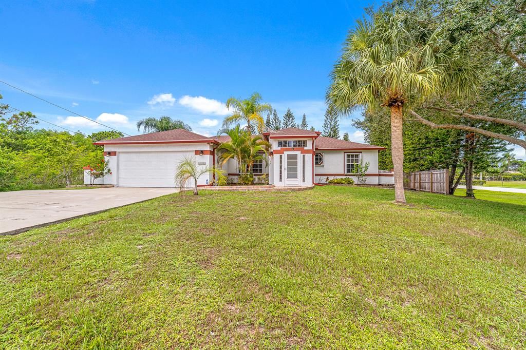 Photo of 1702 SE Berkshire Boulevard Blvd, Port Saint Lucie, FL 34952 (MLS # R10832119)