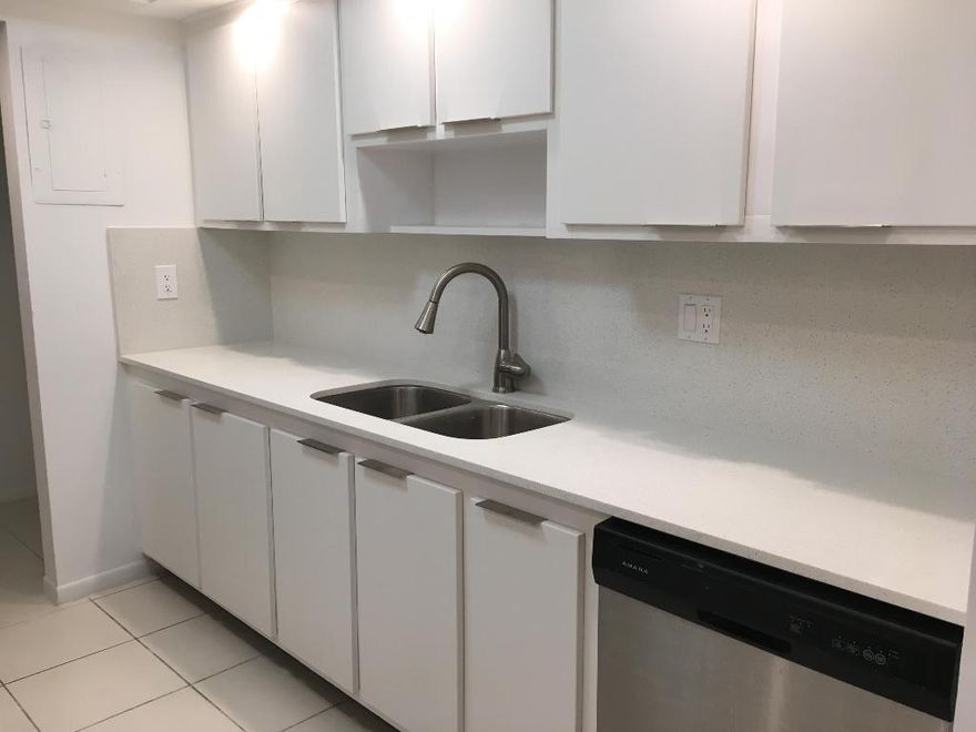 Location location location!  Directly across the road from beautiful South Inlet Beach Park.  Beautifully renovated white cabinets, granite counter top and stainless steel appliances in the kitchen.  Wood floors in the living and dining area, brand new carpets in the bedrooms and freshly painted throughout.  Great community with large heated pool recently renovated club house and tennis court.