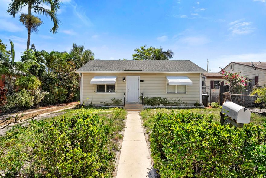 Charming 2-bedroom, 1-bath home with a spacious fenced backyard, beautiful fruit trees, and plenty of parking! This home is full of potential and offers a fantastic opportunity for first-time homebuyers, seasonal residents, or investors seeking a great rental property. Featuring an open floorplan gives the ability to add your personal touch to the main living area.  Tile flooring throughout, tons of natural light, and two generously sized bedrooms await.  Enjoy outdoor living with a large, private yard perfect for entertaining, pets, gardening, or relaxing under the mango trees.  No HOA means added flexibility and freedom. Ideally located just minutes from downtown Lake Worth, the beach, shopping, dining, and the airport, this property combines convenience, and solid investment potential in one affordable package.