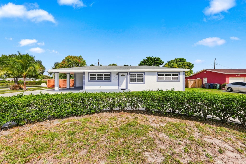 Photo of 1100 7TH Street, Lake Park, FL 33403 (MLS # B26059219)
