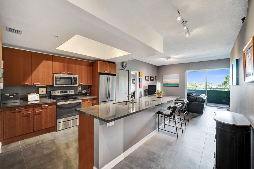 Imagine living at Island City Lofts, the only luxury high-rise building on Wilton Drive. Right outside your door is the heart of Wilton Manors-just seconds from top restaurants, vibrant nightlife, boutique shopping, & more.  This beautifully renovated loft features stunning countertops, travertine floors, & soaring high ceilings that create an open, modern feel. The spacious primary suite offers a large ensuite bathroom, while the interior 2nd bedroom is complemented by an additional full bath. The owner sound proofed all the walls for additional comfort. Enjoy serene pool views from your private balcony. Building amenities include a heated & chilled resort-style pool, fitness center, secured lobby, storage unit, & 2 parking spaces.