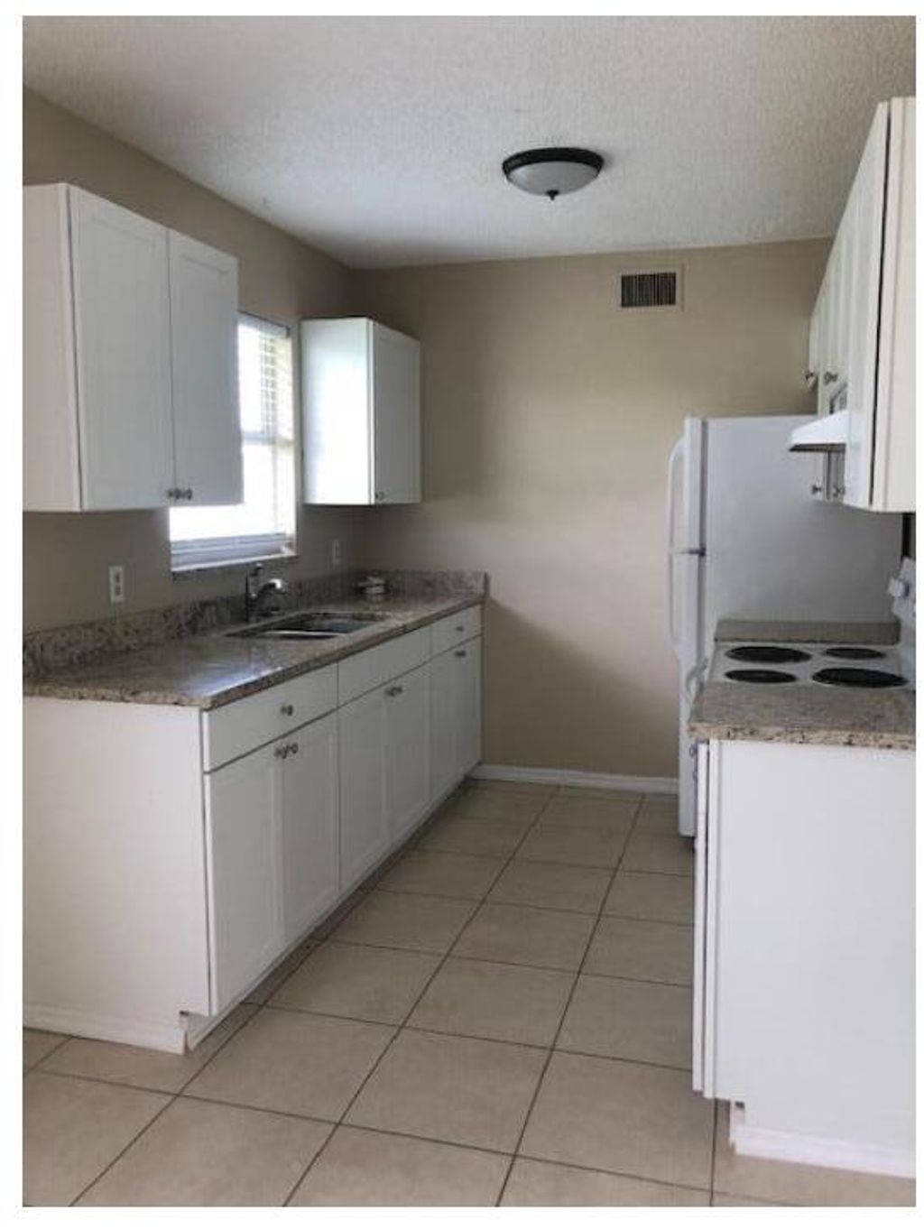 Photo of 1125 SW Colorado Avenue, Port Saint Lucie, FL 34953 (MLS # R11078563)