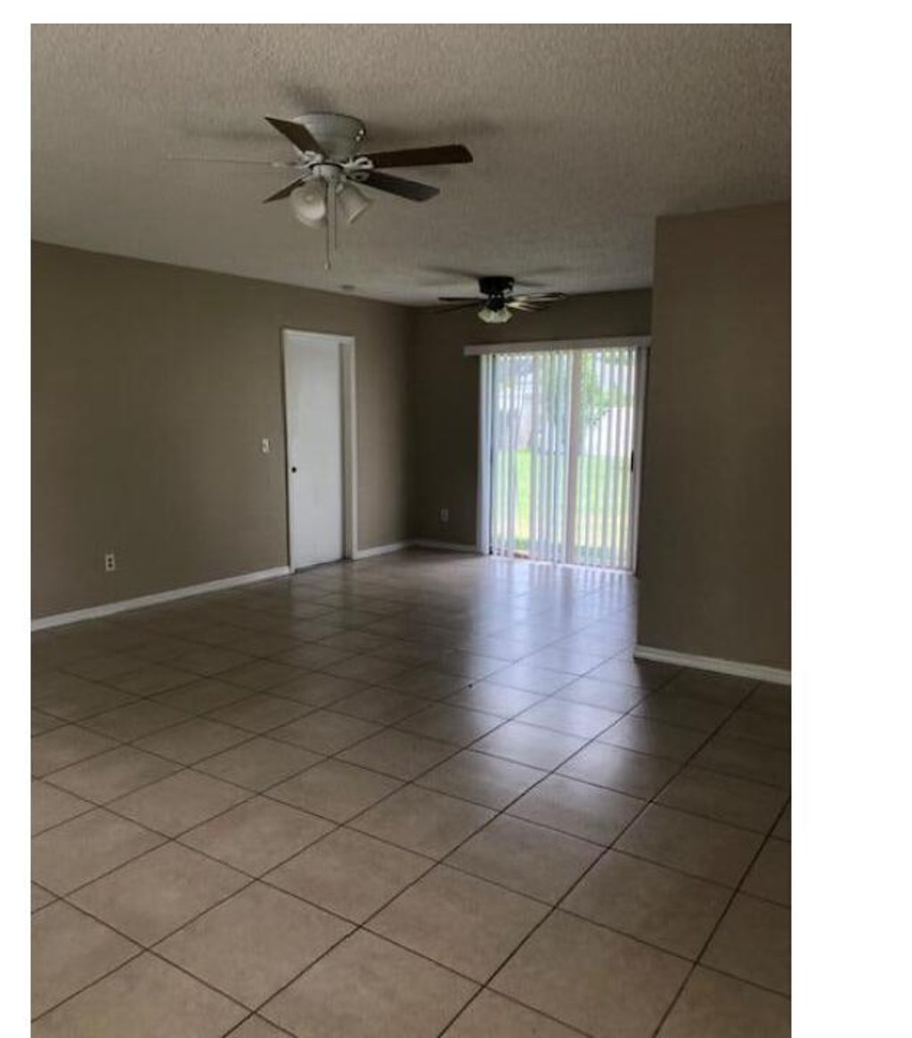 Photo of 1125 SW Colorado Avenue, Port Saint Lucie, FL 34953 (MLS # R11078563)