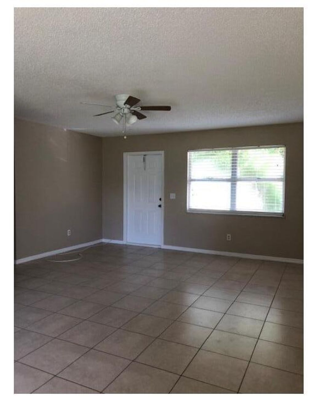 Photo of 1125 SW Colorado Avenue, Port Saint Lucie, FL 34953 (MLS # R11078563)