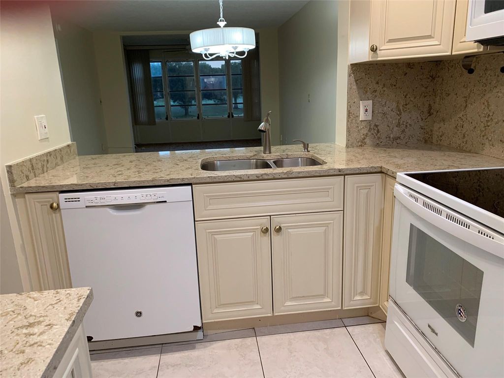 Photo of 9460 Poinciana Place #203, Davie, FL 33324 (MLS # F10540062)