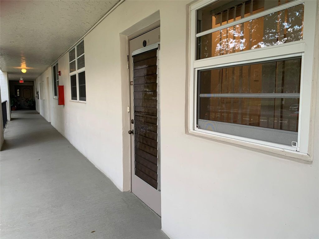 Photo of 9460 Poinciana Place #203, Davie, FL 33324 (MLS # F10540062)