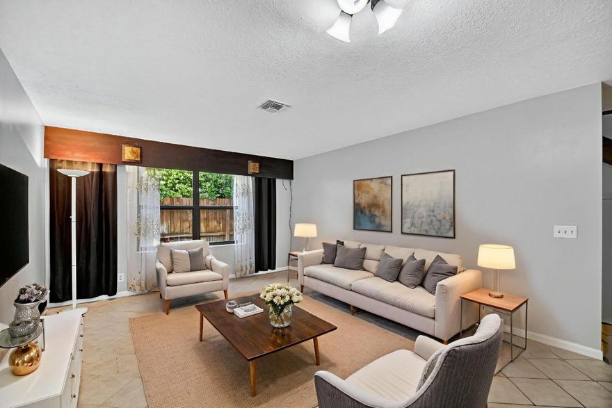 BACK ON MARKET WITH PRICE IMPROVEMENT! Welcome to the charming townhome community of Mango Villas in Lantana! This 2 bedroom, 2 bathroom residence features a private, gated patio ideal for grilling or lounging. Inside is a spacious, open concept kitchen / living area complimented with ceramic tile flooring, contemporary kitchen finishes with stainless appliances. The large primary bedroom offers a relaxing patio with a view of the pool-perfect to enjoy coffee or wine. This home is perfectly located JUST ONE MILE from the intracoastal- putting you just moments from the best boating, beaches, and restaurants!